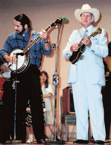 Tom Hanway jamming on stage with Bill Monroe